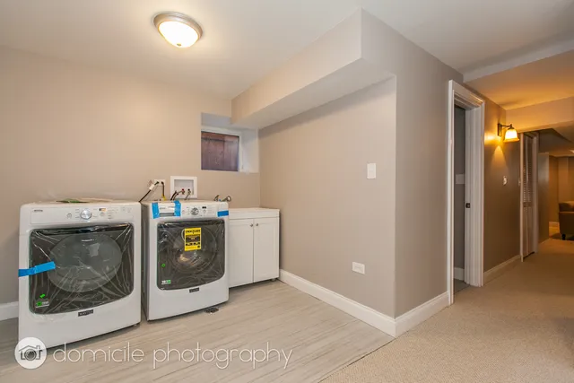 a utility room with washer and dryer