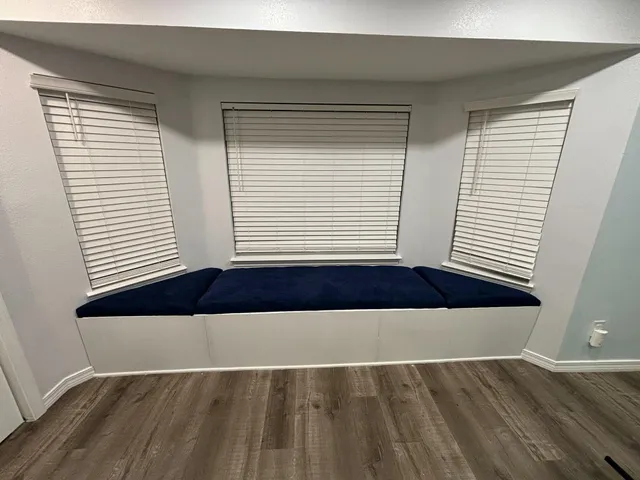 an empty room with wooden floor