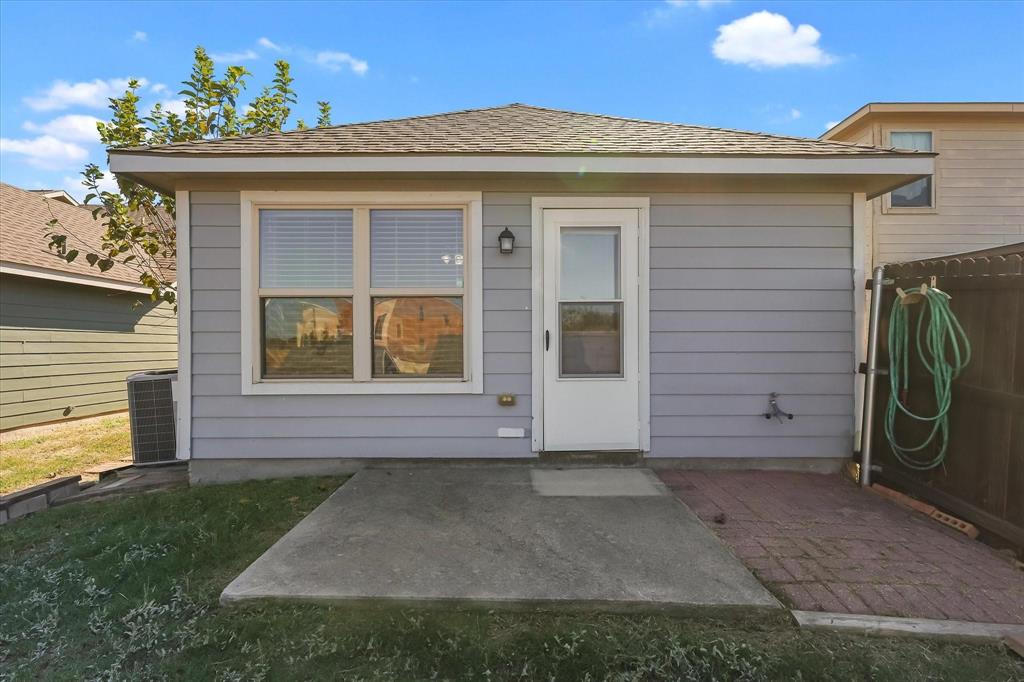 10718 Edgewest Terrace Fort Worth, TX 76108 - Photo 12 of 15 a view of a house with a backyard