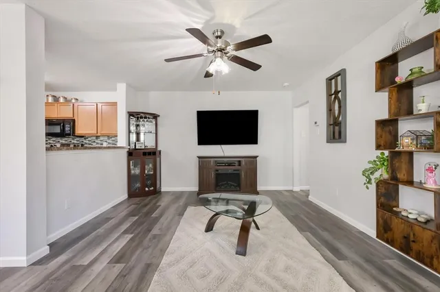 a living room with furniture and a flat screen tv