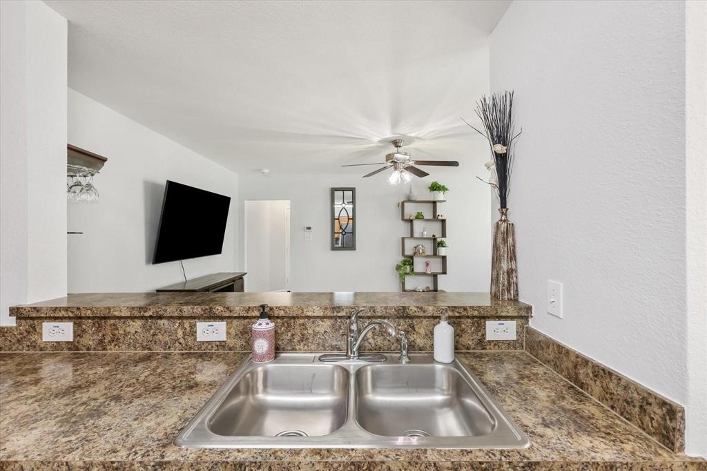 10718 Edgewest Terrace Fort Worth, TX 76108 - Photo 6 of 15 a bathroom with a sink and a mirror