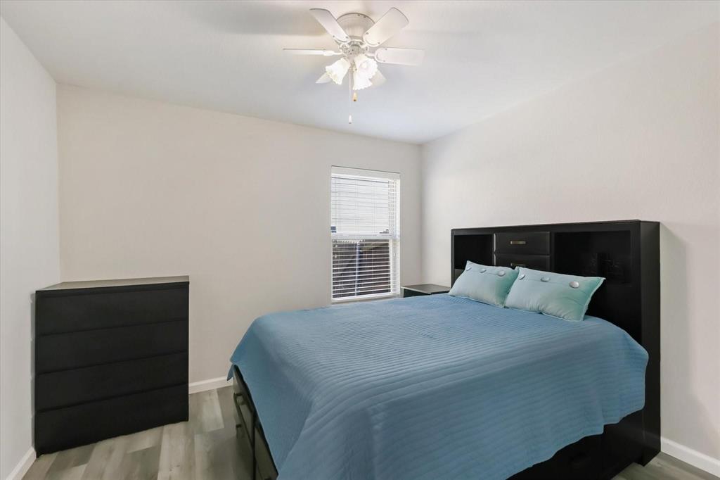 10718 Edgewest Terrace Fort Worth, TX 76108 - Photo 9 of 15 a bedroom with a bed and a dresser