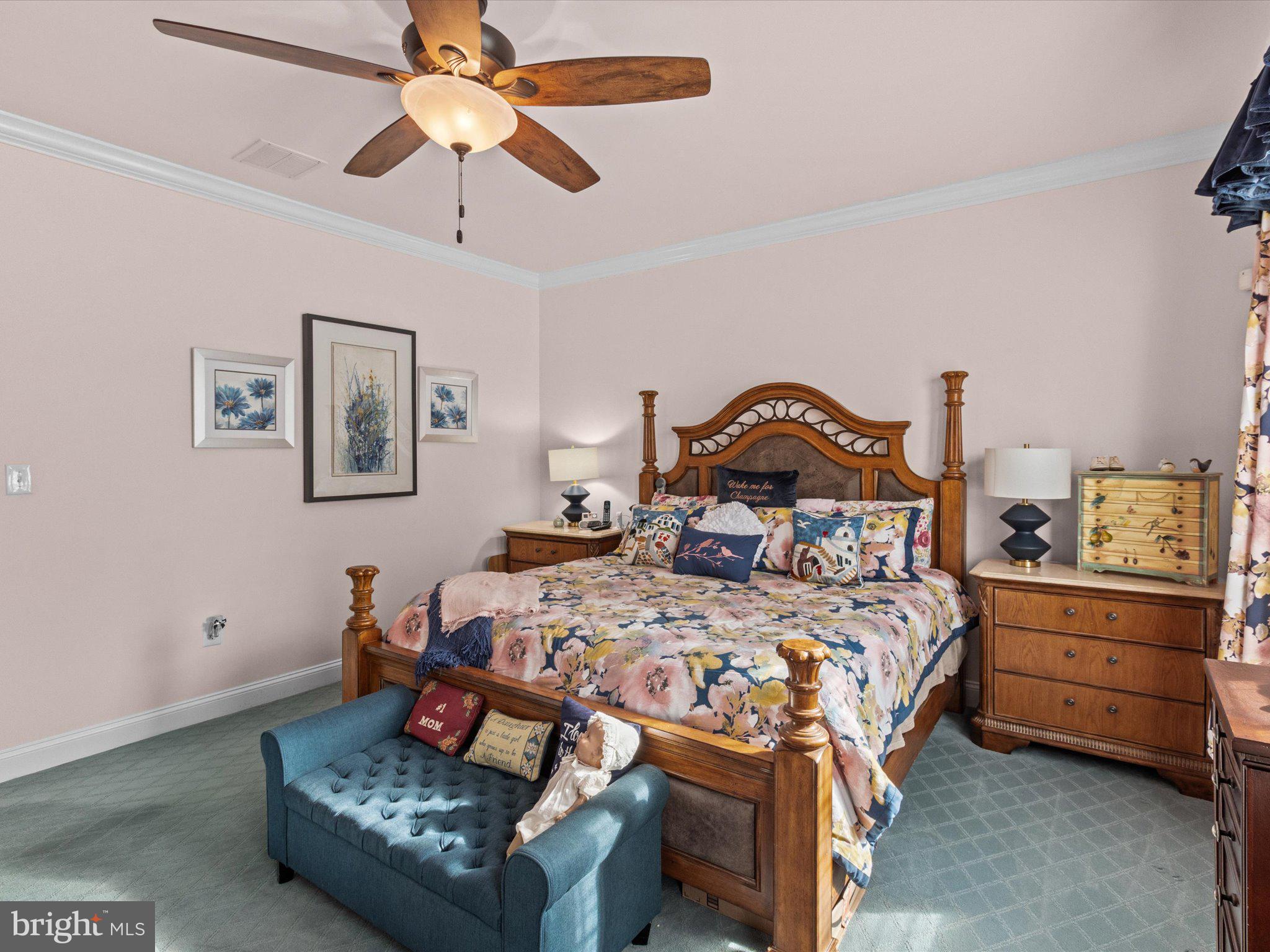6 Marbella Court Hamilton, NJ 08691 - Photo 23 of 46 a bedroom with a bed and a chandelier fan