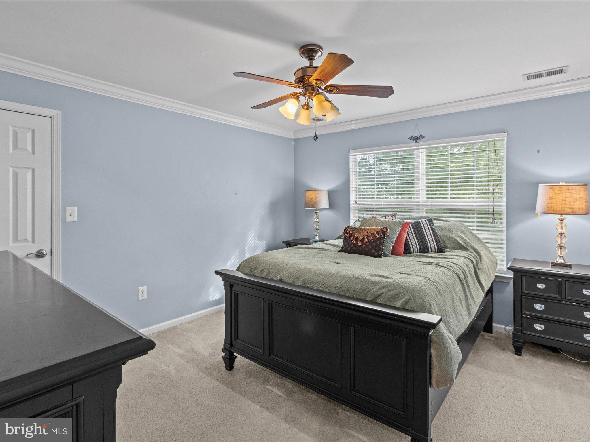 6 Marbella Court Hamilton, NJ 08691 - Photo 38 of 46 a bed sitting in a bedroom next to a window