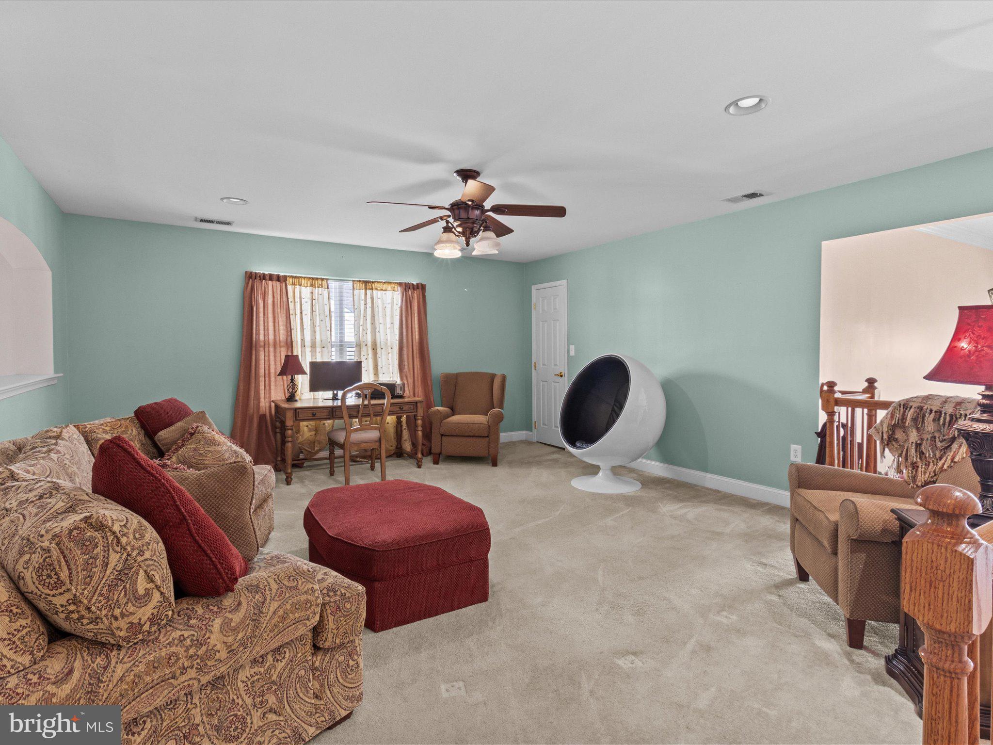 6 Marbella Court Hamilton, NJ 08691 - Photo 40 of 46 a living room with furniture a chandelier and a window