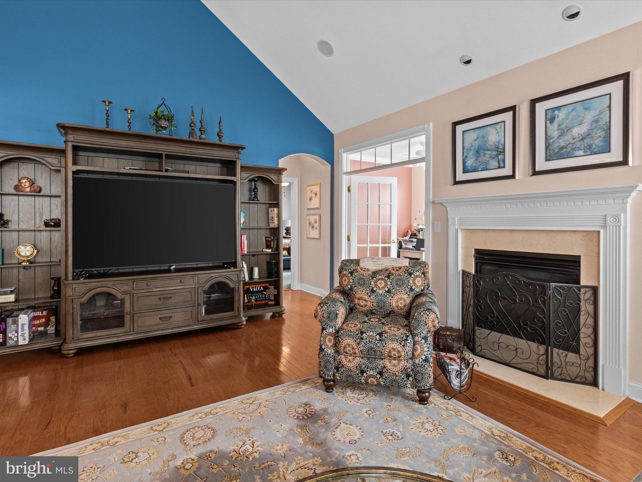 6 Marbella Court Hamilton, NJ 08691 - Photo 4 of 46 a living room with furniture and a flat screen tv