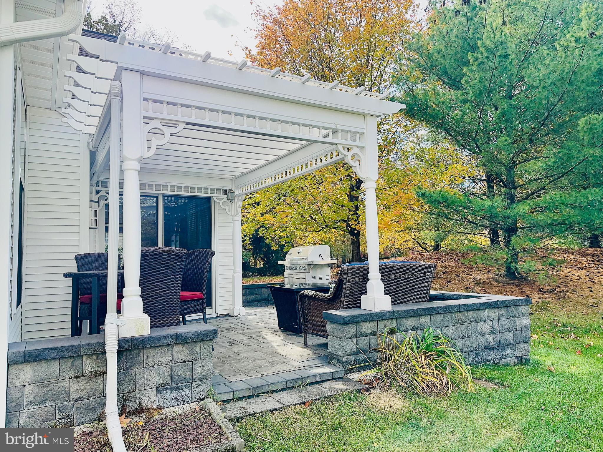6 Marbella Court Hamilton, NJ 08691 - Photo 44 of 46 a view of a patio with table and chairs potted plants and large tree