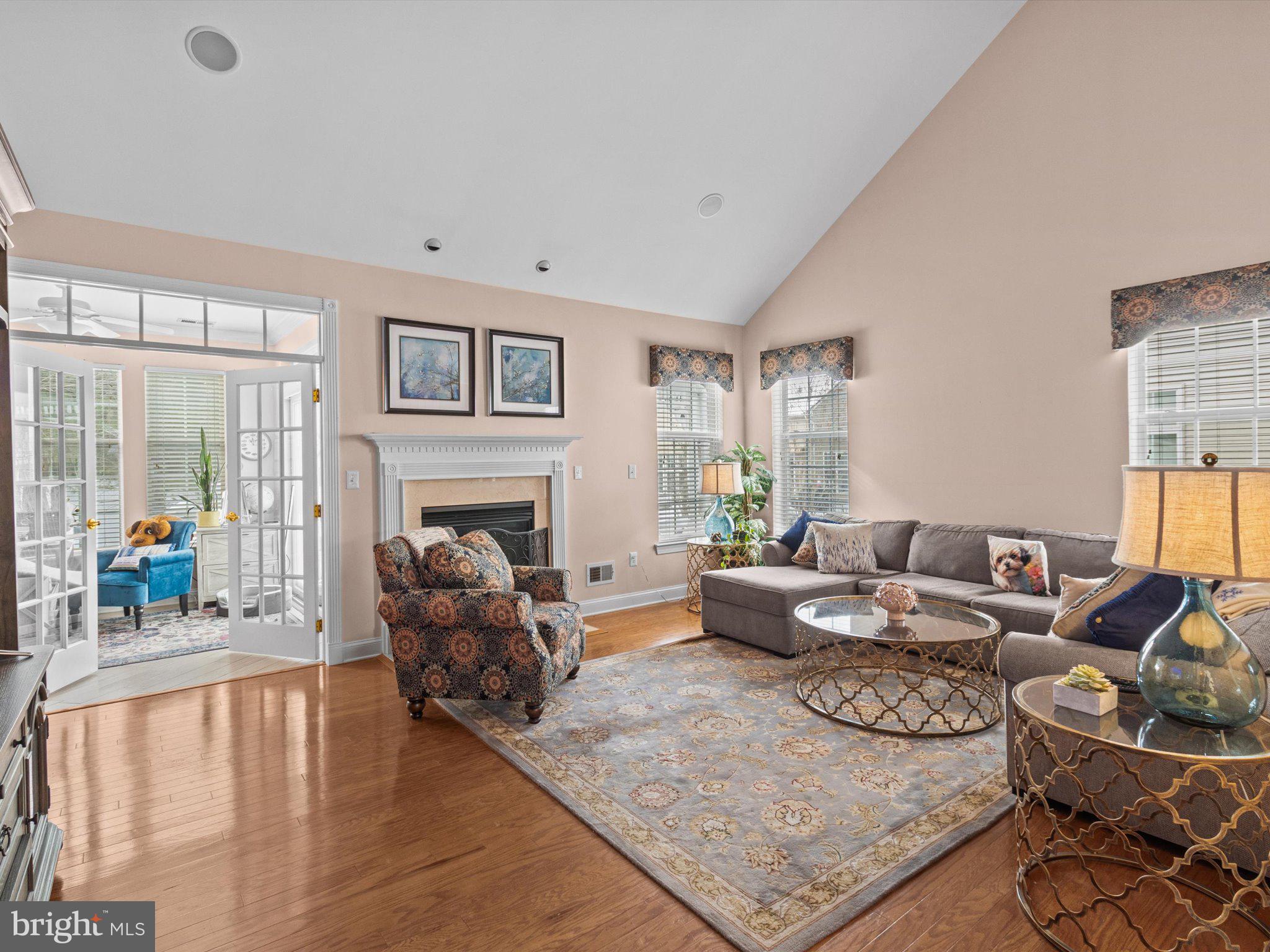 6 Marbella Court Hamilton, NJ 08691 - Photo 8 of 46 a living room with furniture or couch and a fireplace