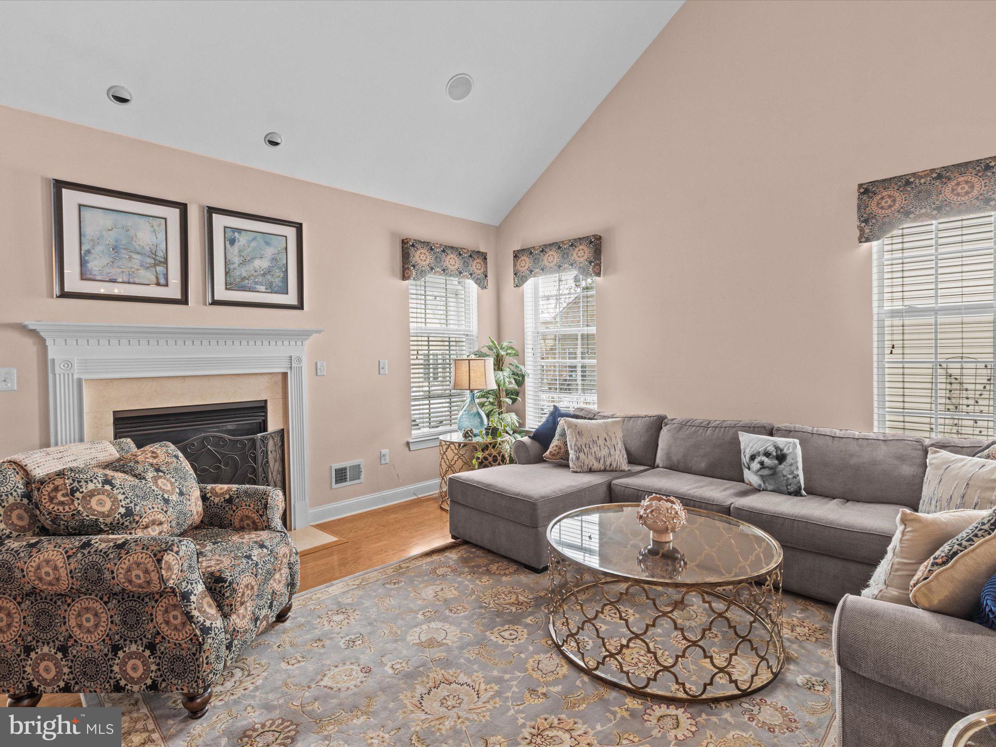 6 Marbella Court Hamilton, NJ 08691 - Photo 9 of 46 a living room with furniture and a fireplace