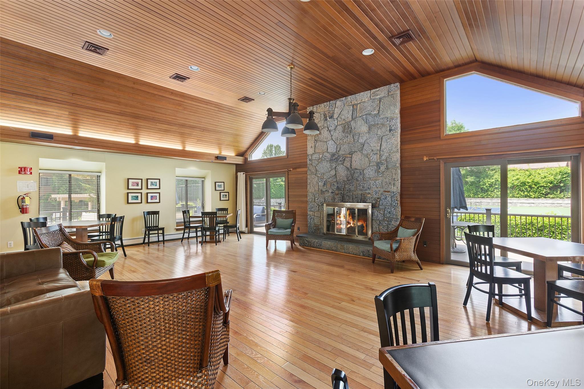 245 Tree Top Crescent Rye Brook, NY 10573 - Photo 18 of 24 a living room with fireplace furniture and a large window