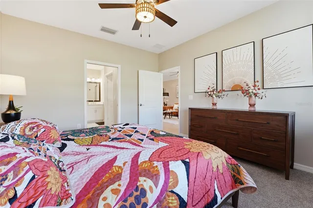 a bedroom with a bed and a dresser