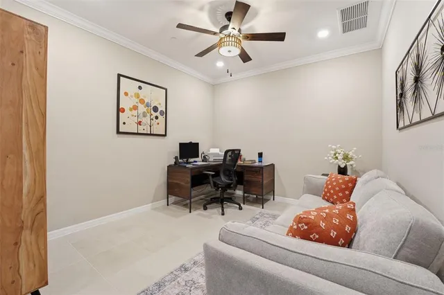 a living room with furniture and a piano