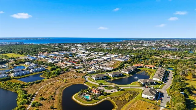 an aerial view of a house with a ocean view