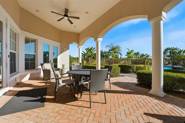 a view of a patio with table and chairs potted plants with wooden floor