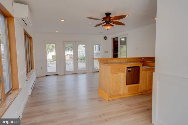 an entryway with wooden floor