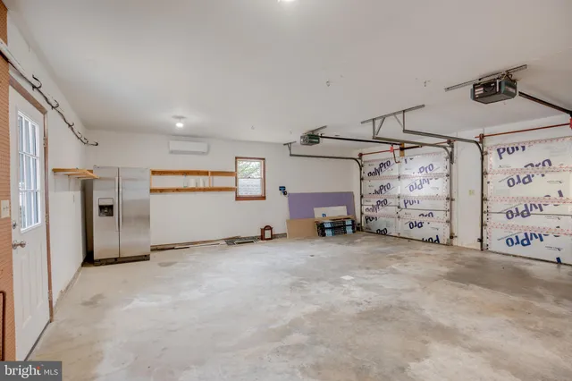 a backyard of a house with large trees