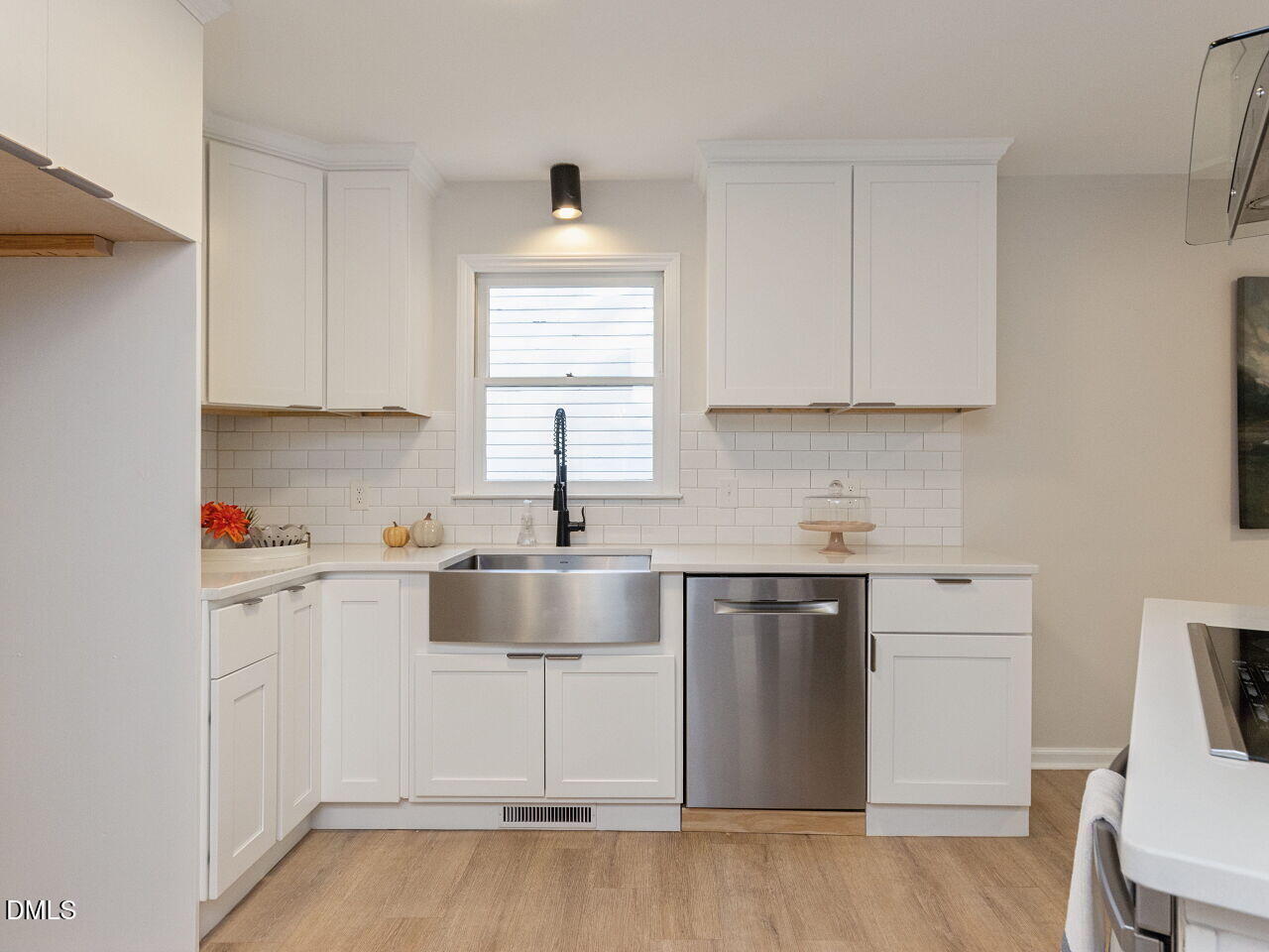 Remodeled Kitchen, new cabinets, ss steal farm house sink, quartz counters, built-in frigidaire oven, flat top, new ss hood and dishwasher.