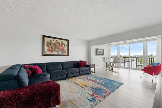a living room with furniture and a rug