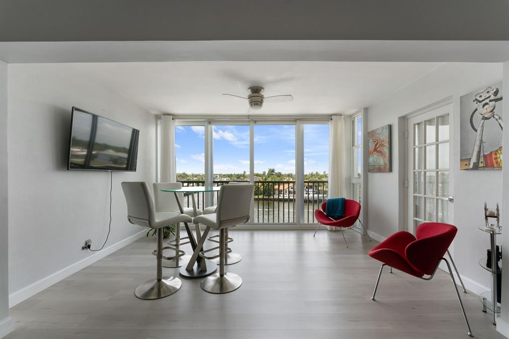 615 North Riverside Drive, Unit 502 Pompano Beach, FL 33062 - Photo 13 of 43 a view of a dining room with furniture window and outside view