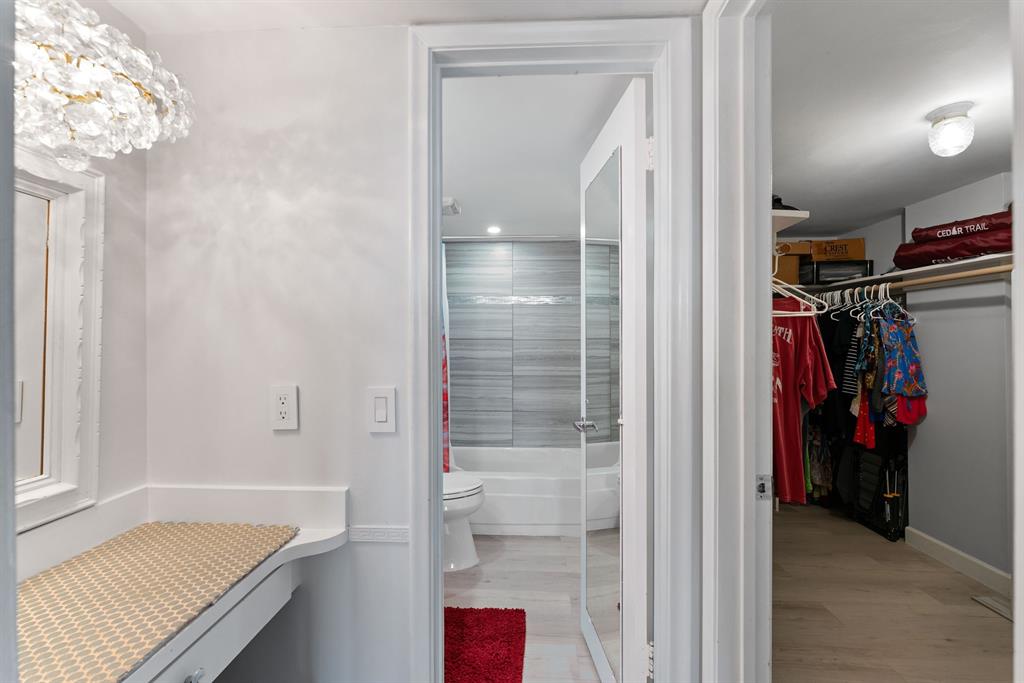 615 North Riverside Drive, Unit 502 Pompano Beach, FL 33062 - Photo 23 of 43 a view of walk in closet with clothes and shoes