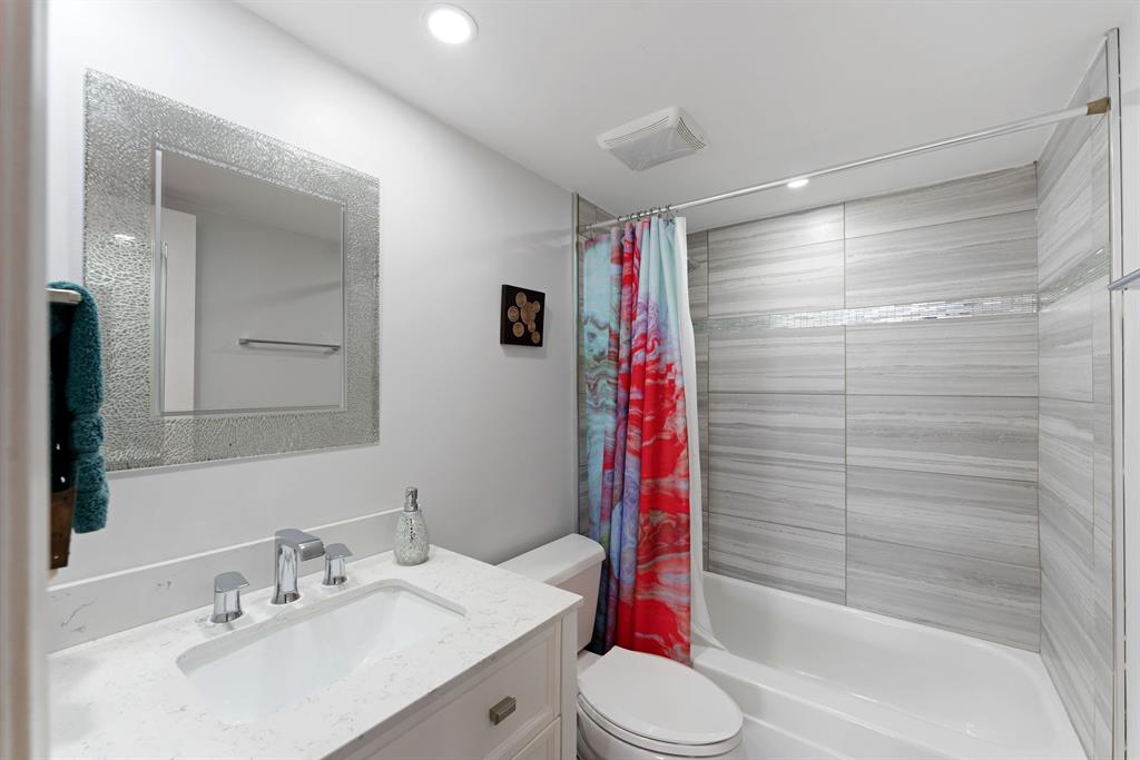 615 North Riverside Drive, Unit 502 Pompano Beach, FL 33062 - Photo 24 of 43 a bathroom with a sink toilet and shower