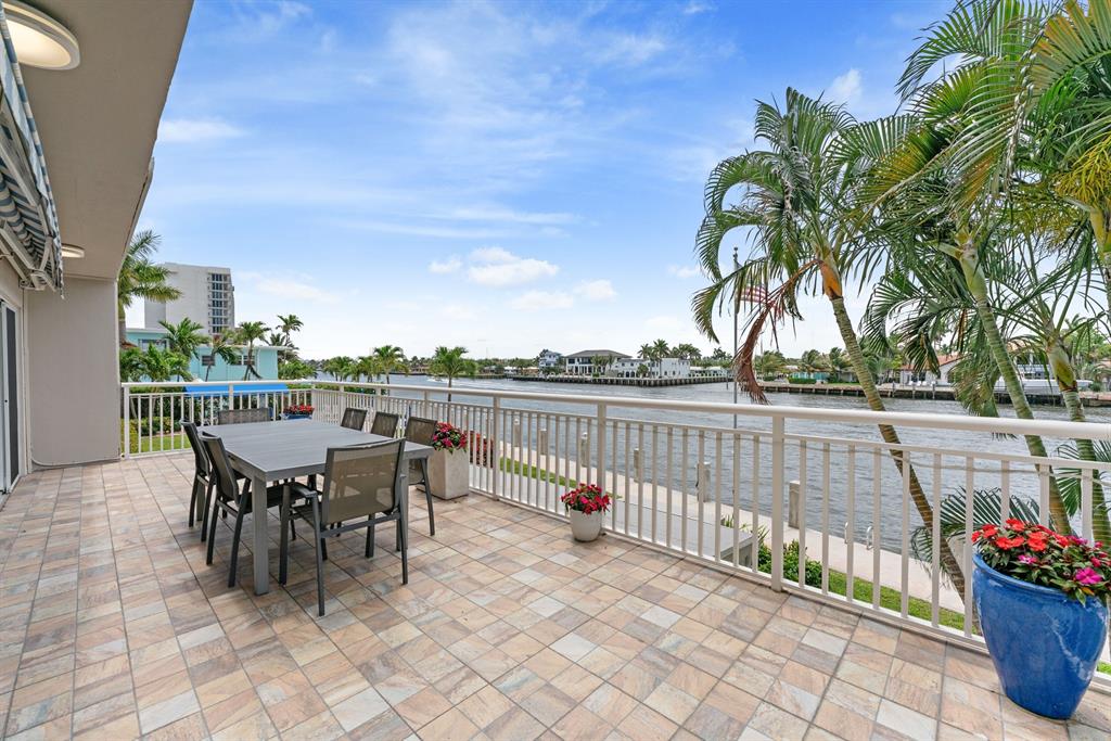615 North Riverside Drive, Unit 502 Pompano Beach, FL 33062 - Photo 31 of 43 a view of a chairs and table in patio