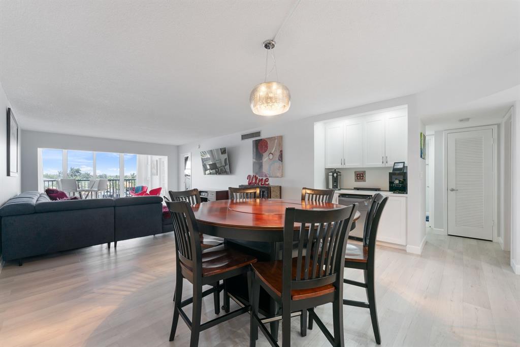 615 North Riverside Drive, Unit 502 Pompano Beach, FL 33062 - Photo 9 of 43 a view of a dining room with furniture