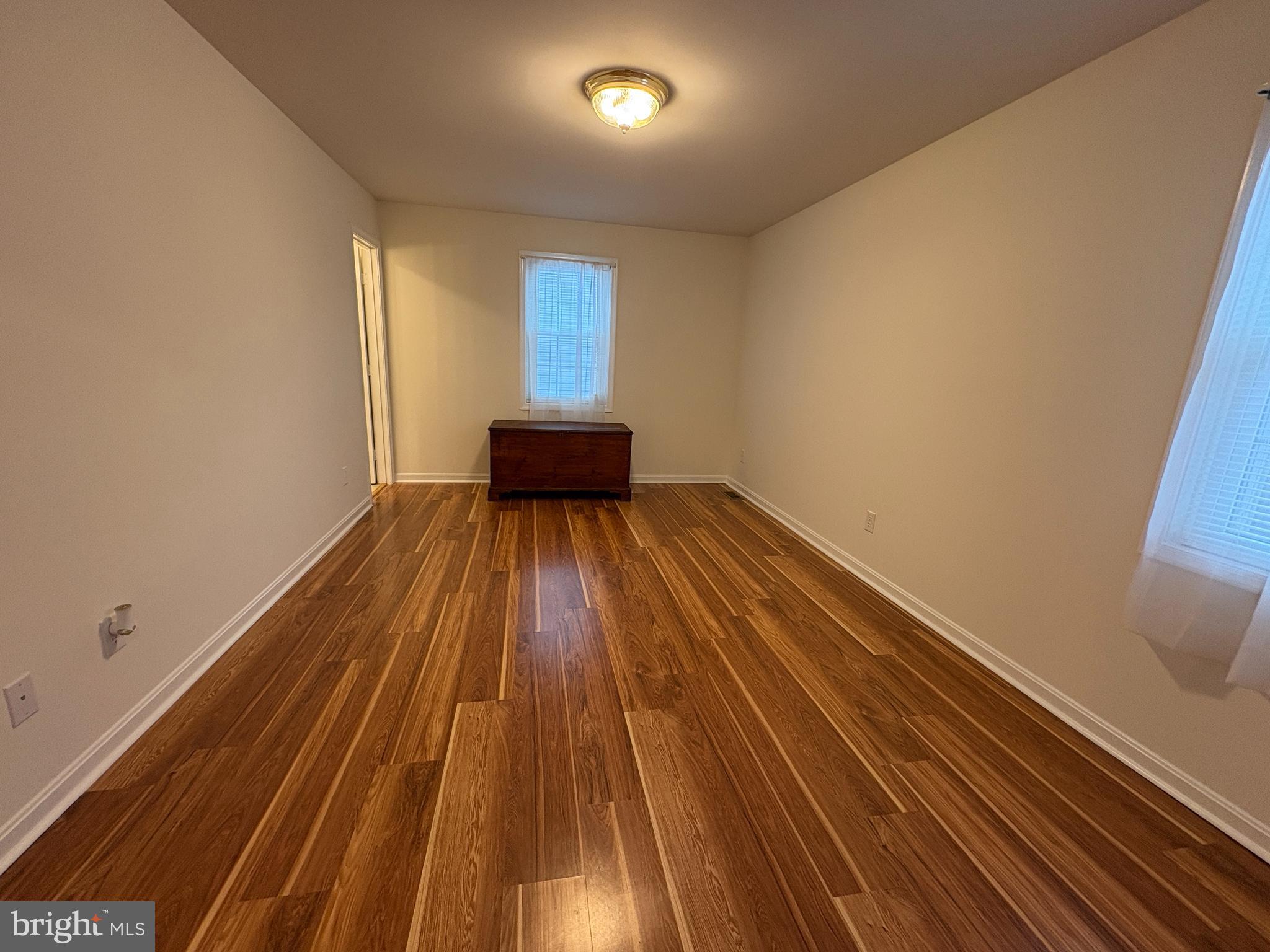 180 King Street Culpeper, VA 22701 - Photo 13 of 22 a view of an empty room with wooden floor