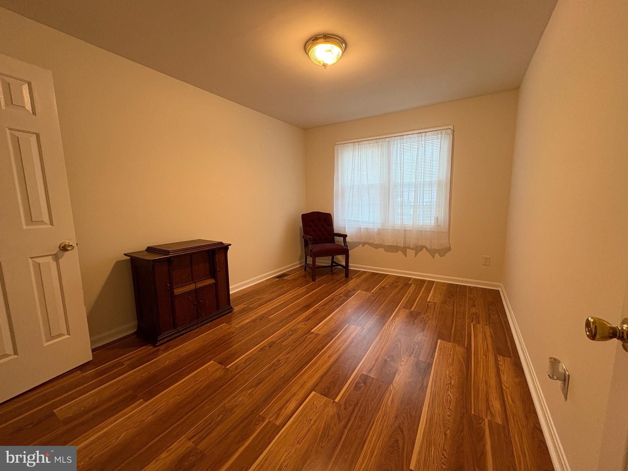 180 King Street Culpeper, VA 22701 - Photo 16 of 22 a view of a room with wooden floor and two windows