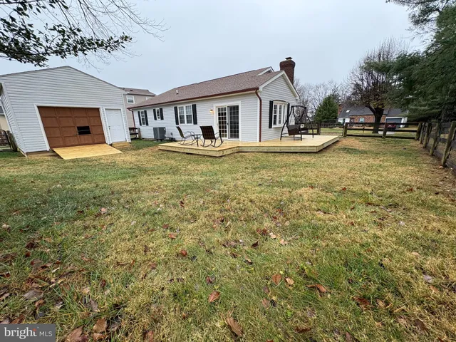 a front view of house with yard and seating area