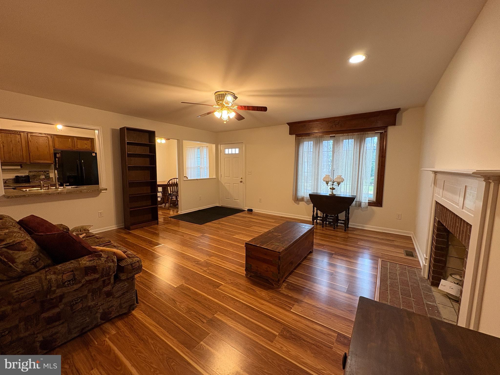 180 King Street Culpeper, VA 22701 - Photo 3 of 22 a living room with furniture and a fireplace