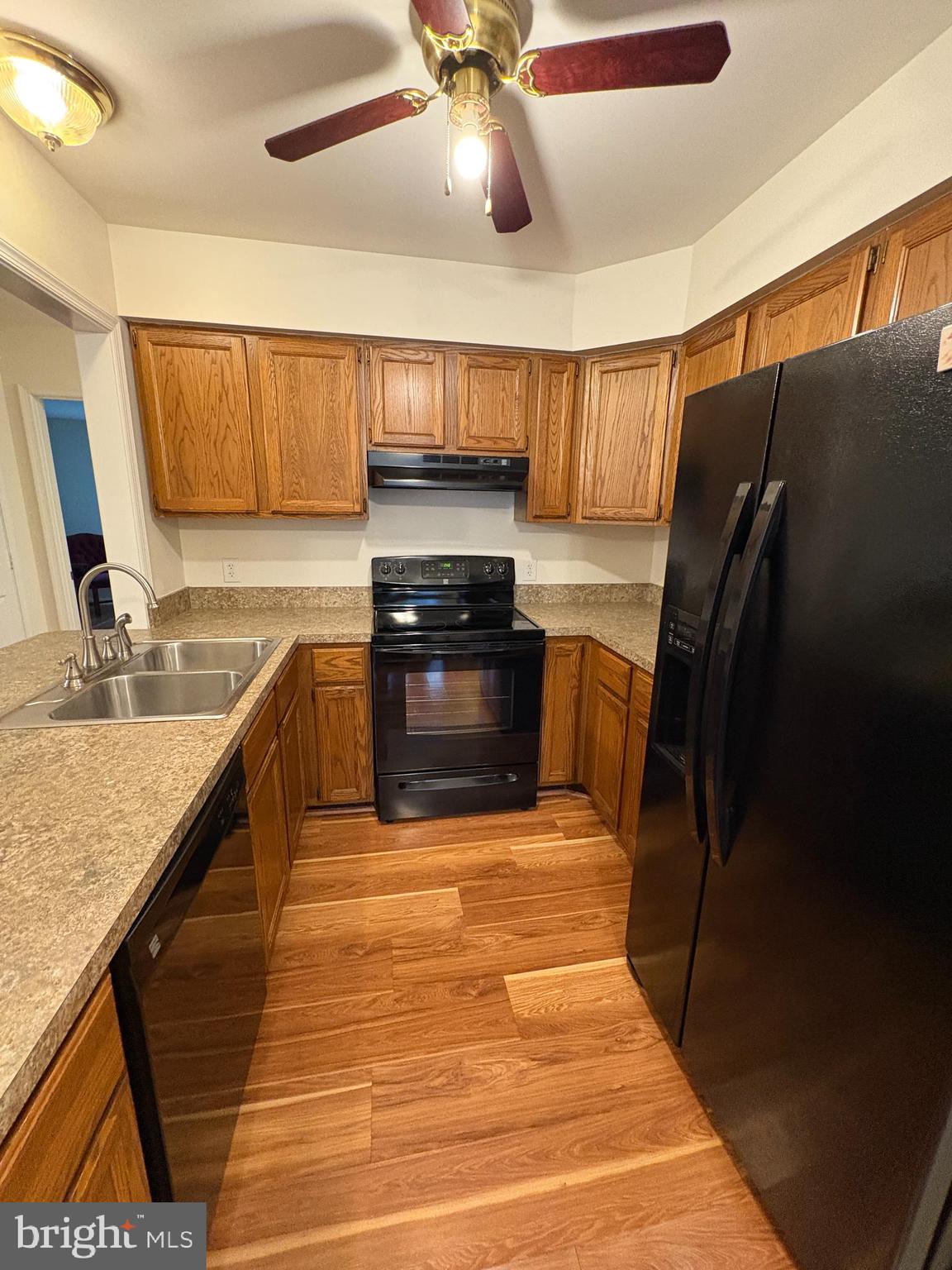 180 King Street Culpeper, VA 22701 - Photo 9 of 22 a kitchen with stainless steel appliances granite countertop a sink stove and refrigerator