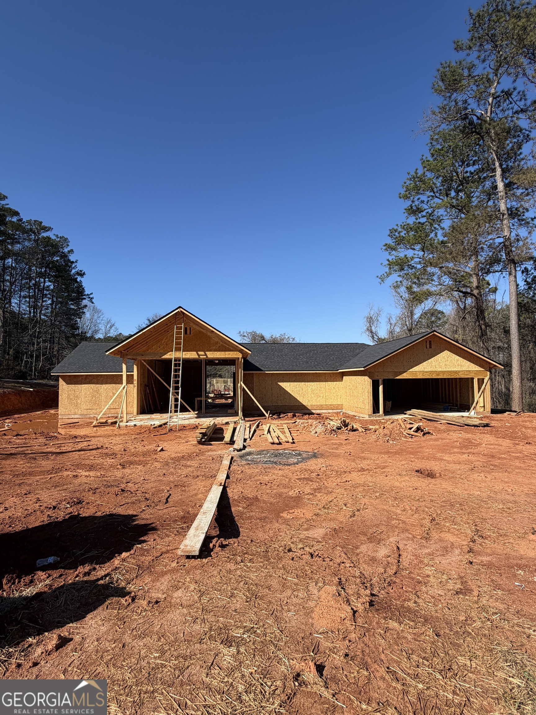 a view of a house with a snow in the yard