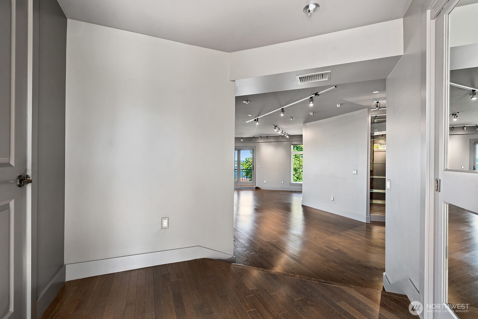 745 Bellevue Avenue East, Unit 402 Seattle, WA 98102 - Photo 4 of 39 a view of empty room with wooden floor