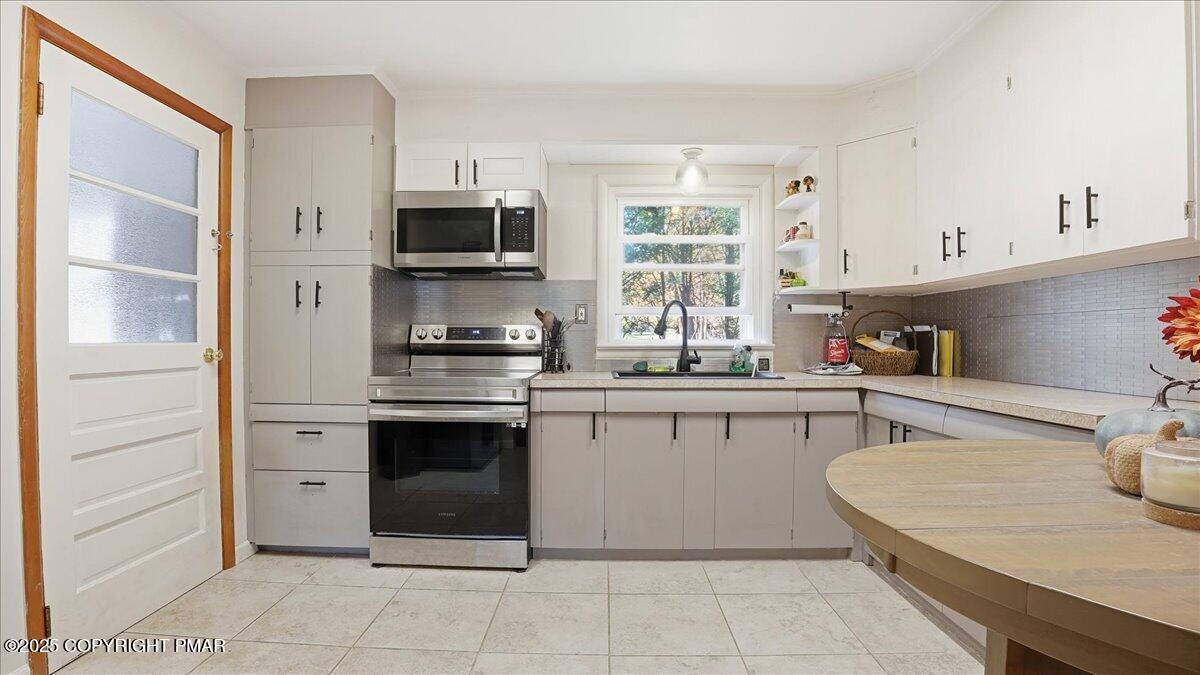 612 Prices Drive Cresco, PA 18326 - Photo 11 of 37 a kitchen with a sink and white cabinets