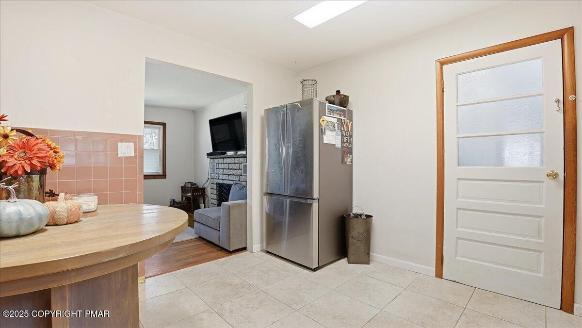 612 Prices Drive Cresco, PA 18326 - Photo 15 of 37 a kitchen with a refrigerator and cabinets