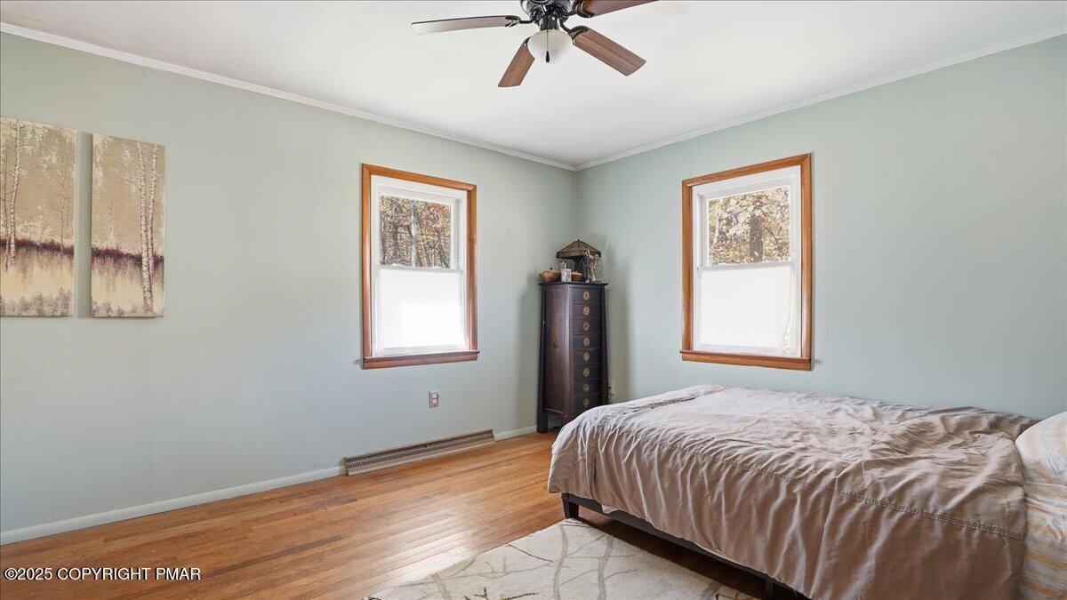 612 Prices Drive Cresco, PA 18326 - Photo 18 of 37 a bedroom with a bed and a window