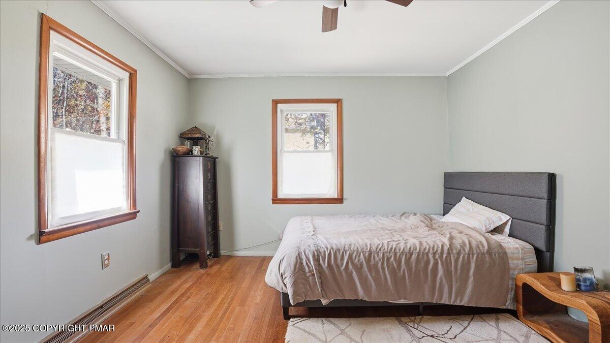 612 Prices Drive Cresco, PA 18326 - Photo 19 of 37 a bedroom with a bed and a painting on the wall