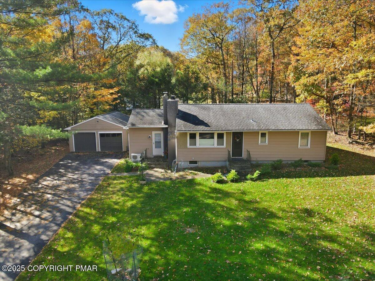 612 Prices Drive Cresco, PA 18326 - Photo 2 of 37 a front view of a house with yard