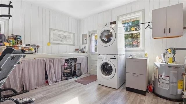 an aerial view of a house with yard and a tree