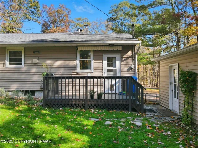 a view of a house with a yard and plants