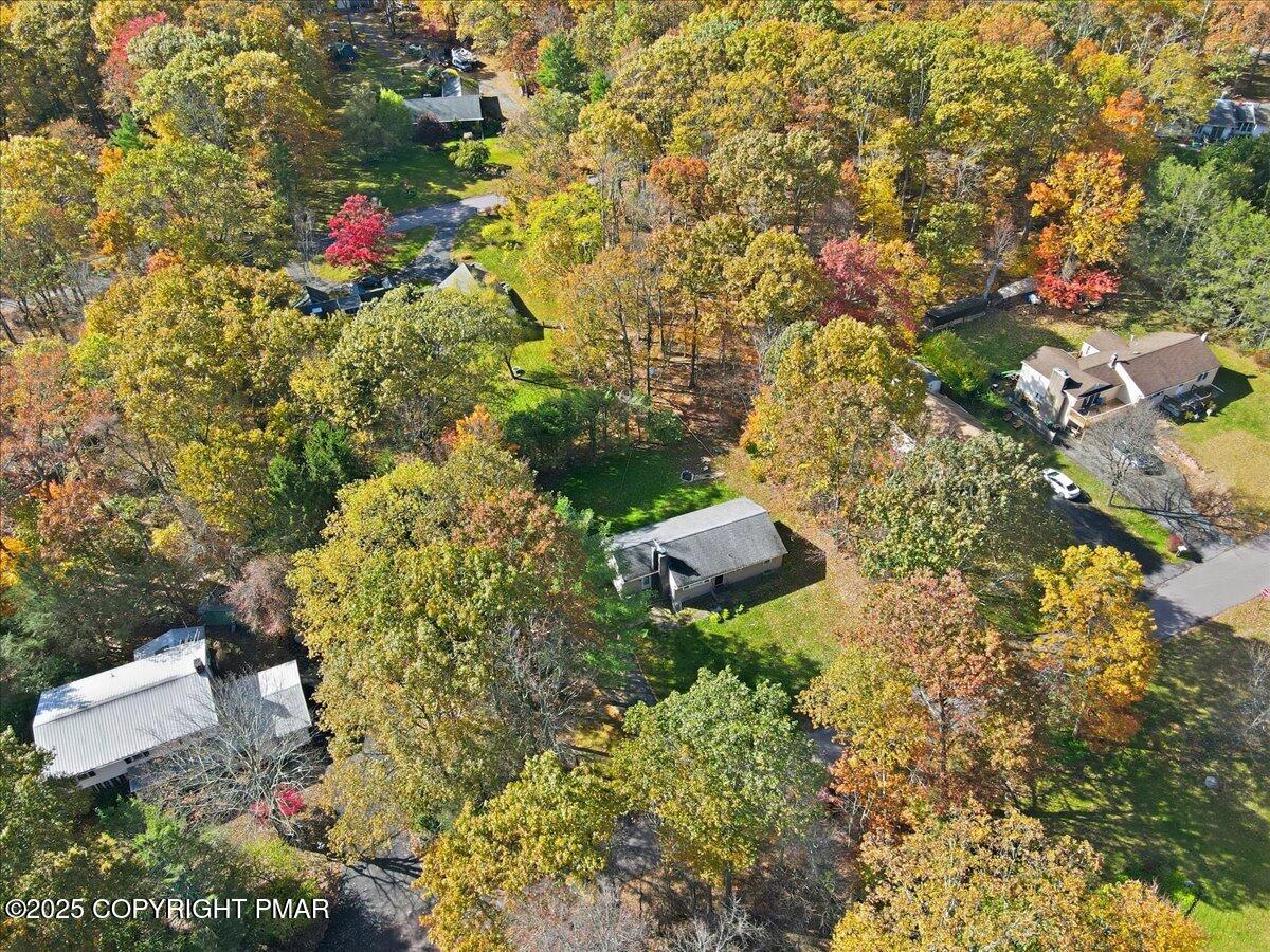 612 Prices Drive Cresco, PA 18326 - Photo 35 of 37 a view of a house with a yard and plants