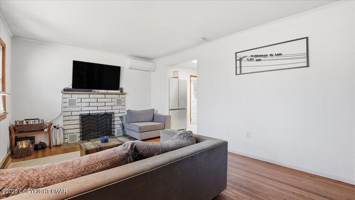 612 Prices Drive Cresco, PA 18326 - Photo 5 of 37 a living room with furniture and a flat screen tv