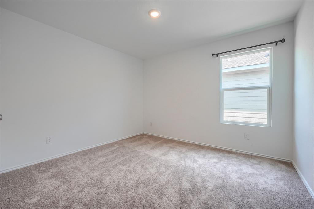 5916 Crystal Water Way Princeton, TX 75407 - Photo 14 of 28 a view of an empty room with a window