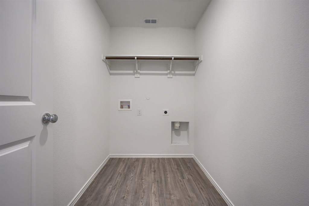 5916 Crystal Water Way Princeton, TX 75407 - Photo 19 of 28 a view of small space with racks on the wall