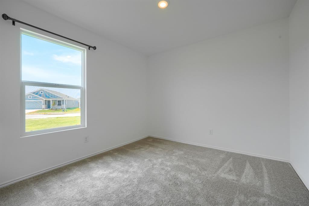 5916 Crystal Water Way Princeton, TX 75407 - Photo 20 of 28 an empty room with a window