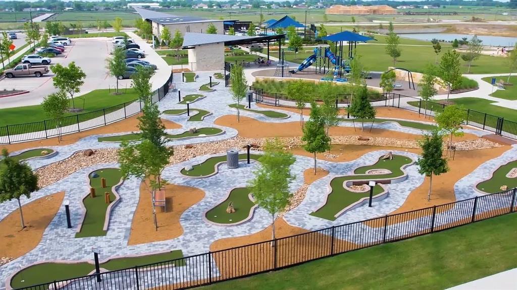 5916 Crystal Water Way Princeton, TX 75407 - Photo 28 of 28 an aerial view of residential houses with outdoor space and parking