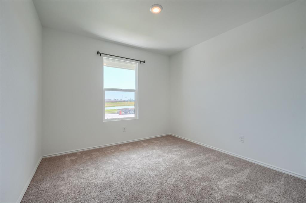 5916 Crystal Water Way Princeton, TX 75407 - Photo 10 of 28 an empty room with a window