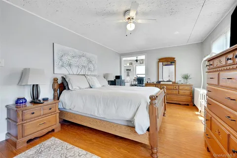 a view of a bedroom with bed and tv