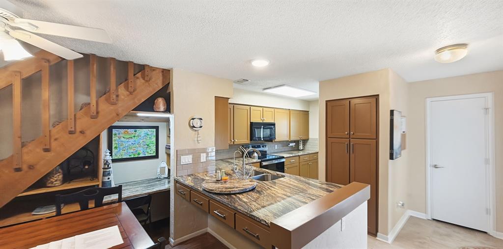 3037 Hells Gate Loop, Unit C208 Strawn, TX 76475 - Photo 10 of 24 a view of a kitchen area